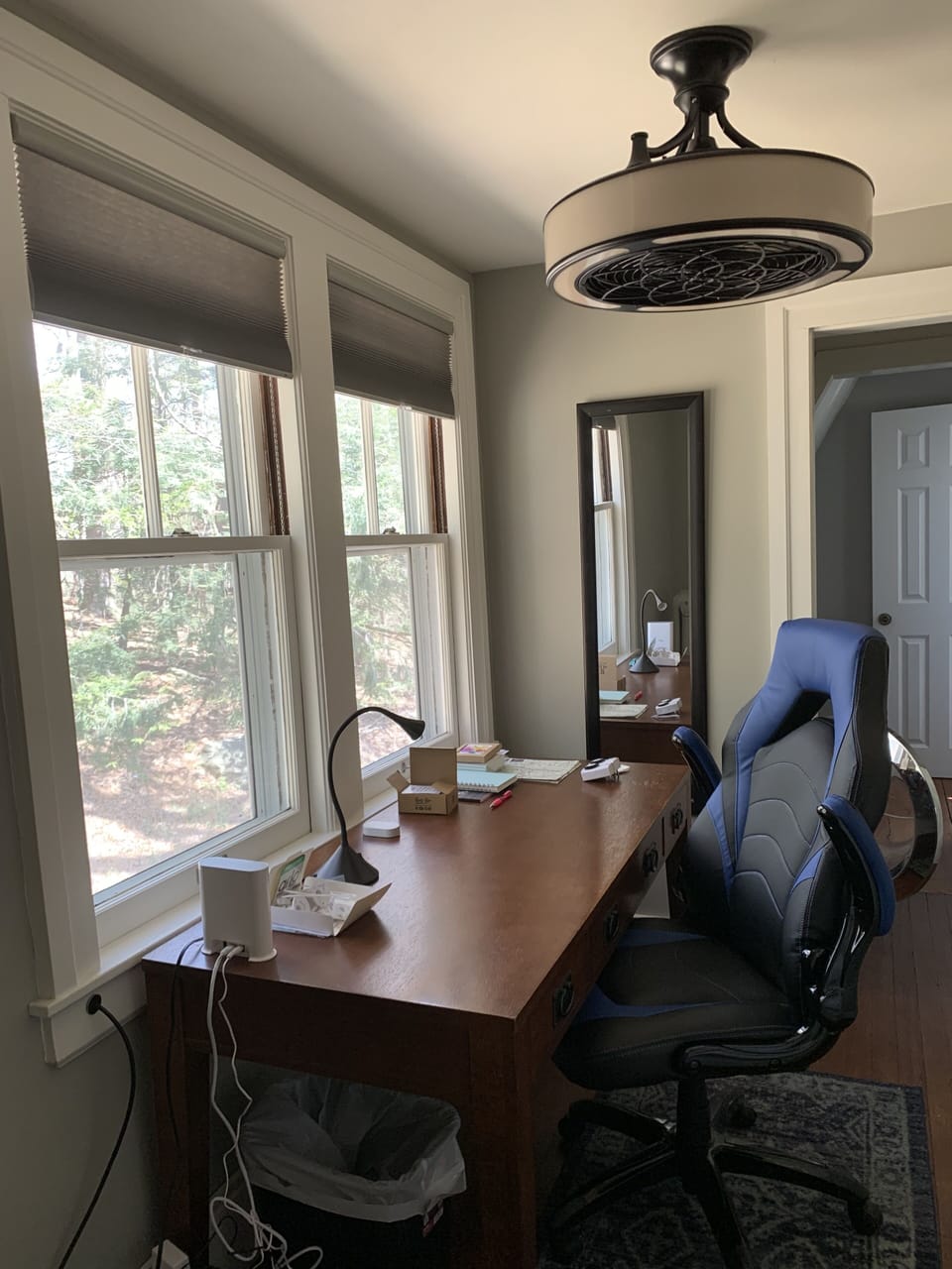 Office on 2nd fl has desk, chair, bookshelves, and view of Laurel Hill forest
