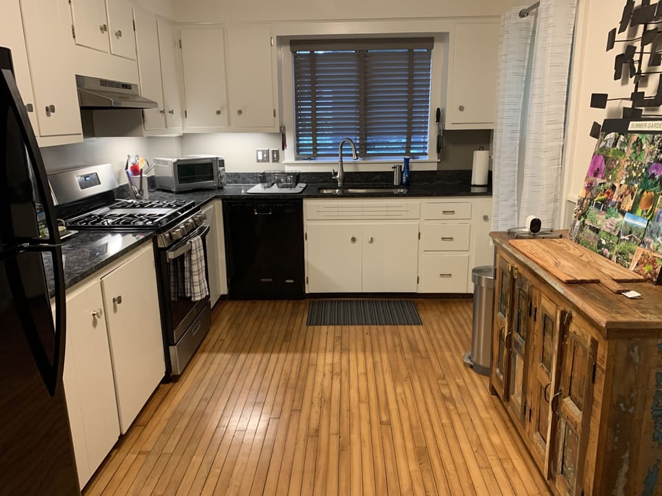 Kitchen is fully stocked with gas range, toaster oven, microwave, coffee maker