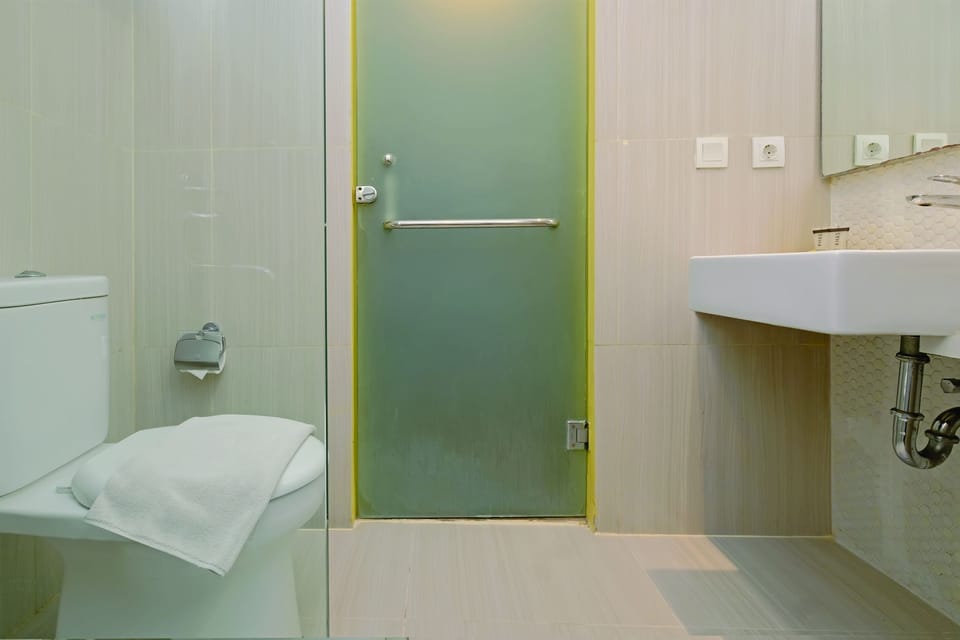 Shower, rainfall showerhead, slippers, towels