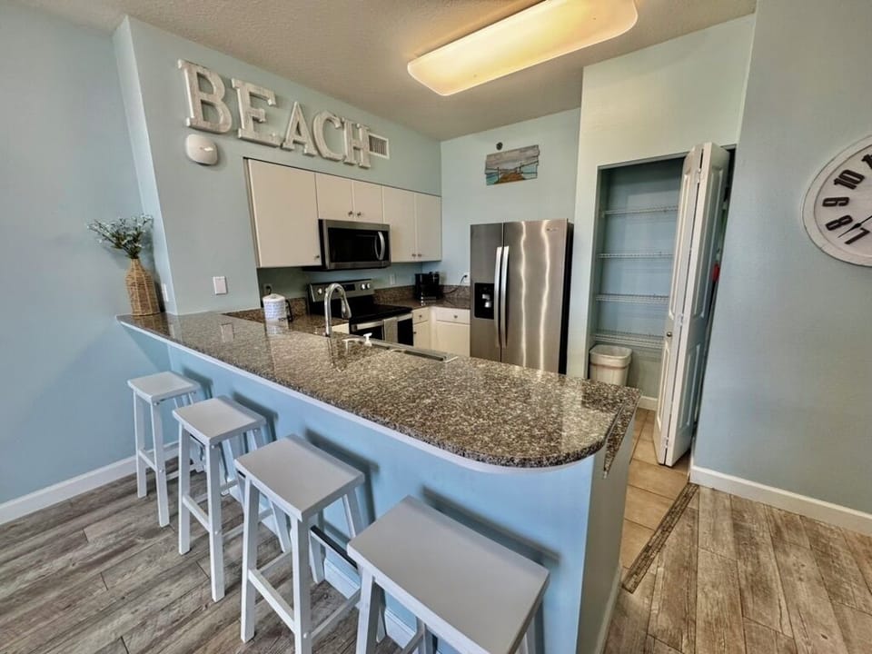 Stainless appliances, granite countertops, and pantry for ample storage