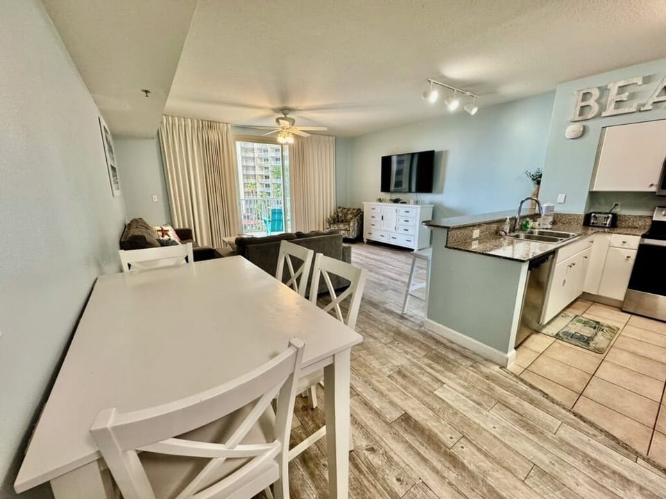Enjoy your meals at the counter height dining table and bar