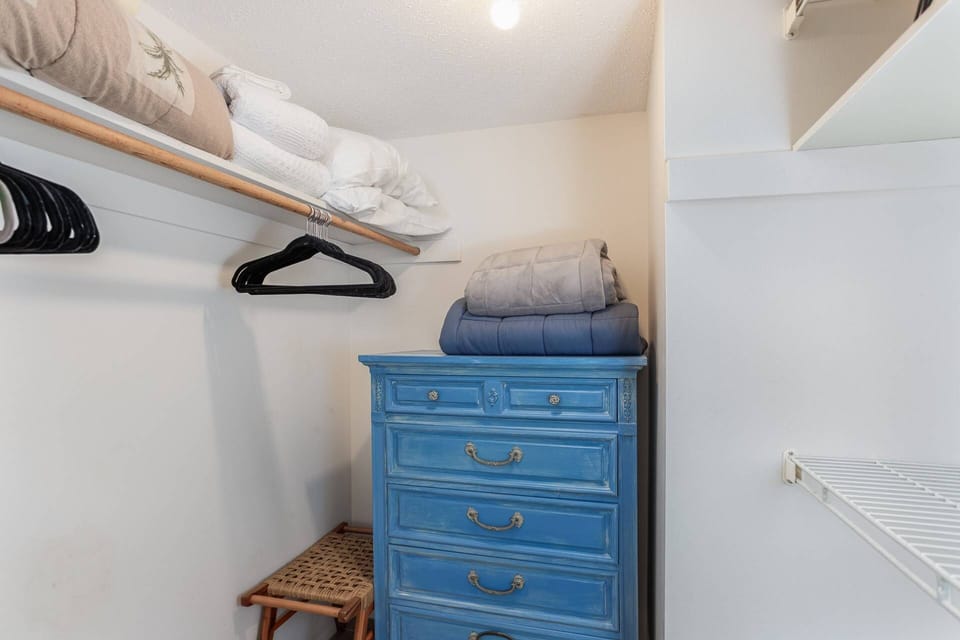 Guest bedroom with walk-in closet.  Dresser to neatly put away your new vacation clothes