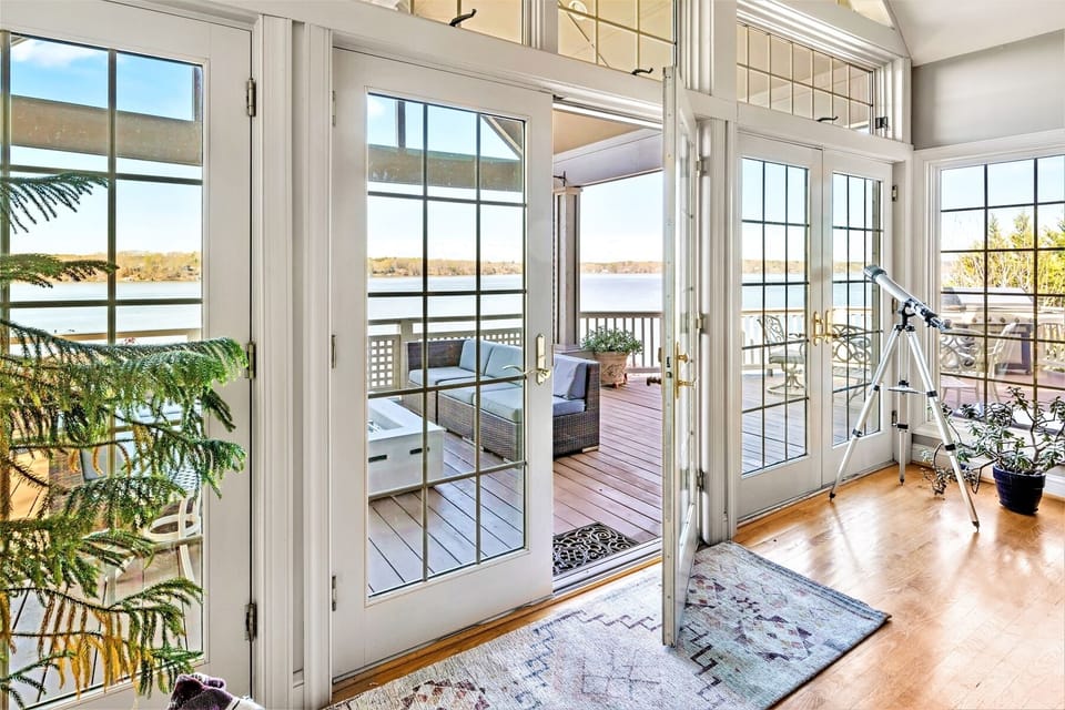 Panoramic main lake views from living room/dining/kitchen