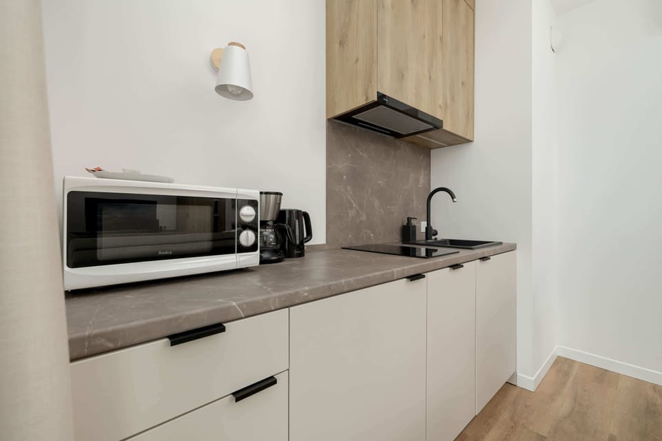The kitchenette's practical layout maximizes space and functionality.