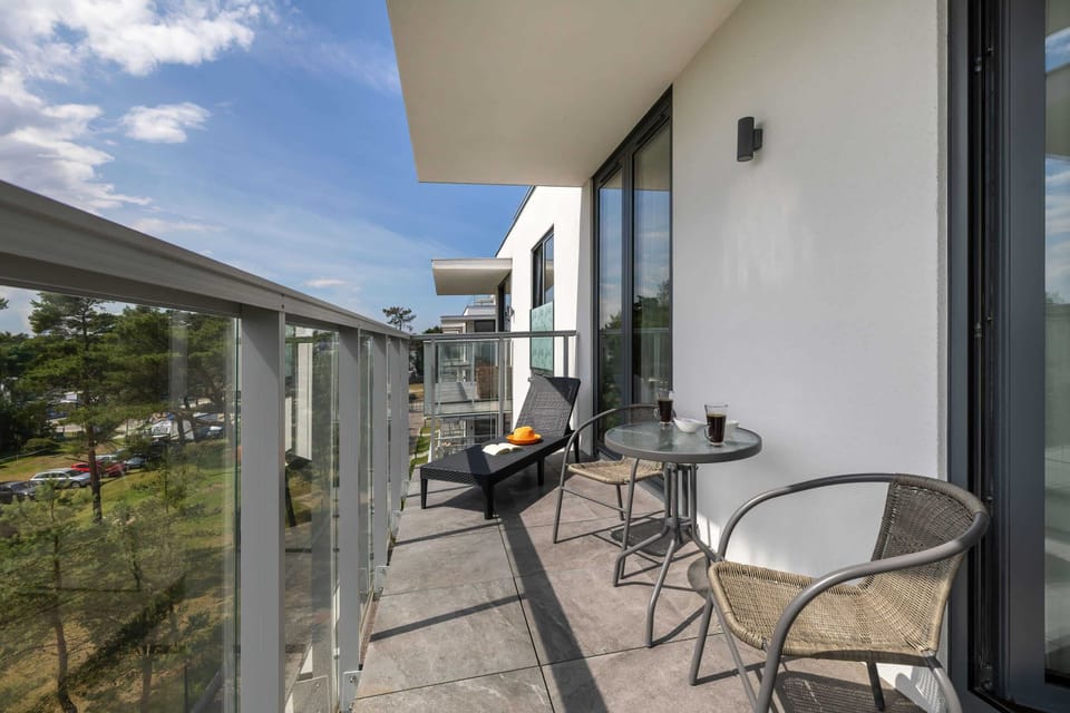 The balcony provides a perfect spot for enjoying the fresh air. 