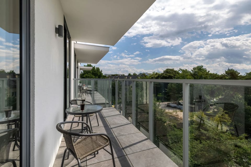 The balcony provides a tranquil spot for enjoying a book. 