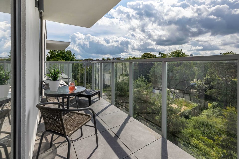 The balcony provides a tranquil spot for enjoying a book. 