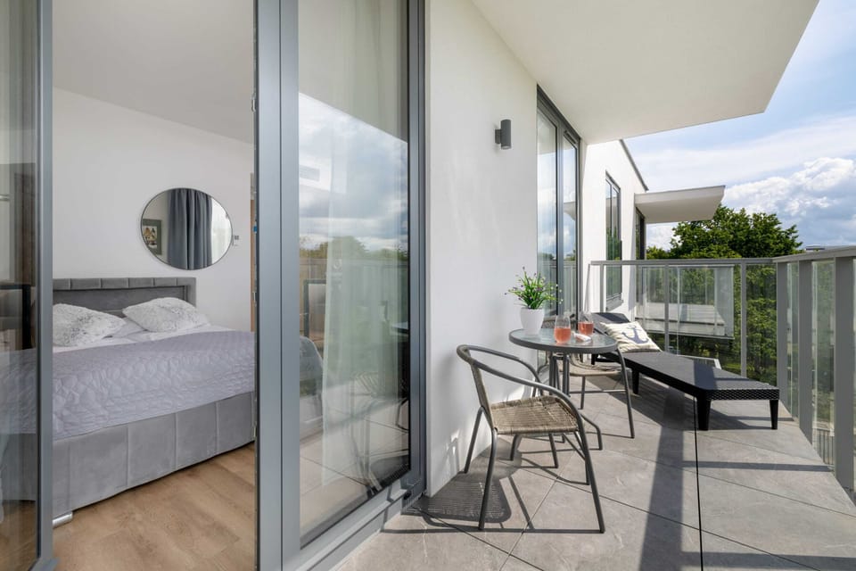 The balcony provides a serene environment for relaxation. 