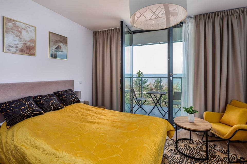 Enjoy your favorite shows on the flat-screen television in the elegant living area.