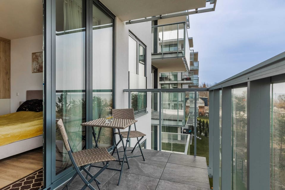 The balcony provides a serene environment for relaxation. 