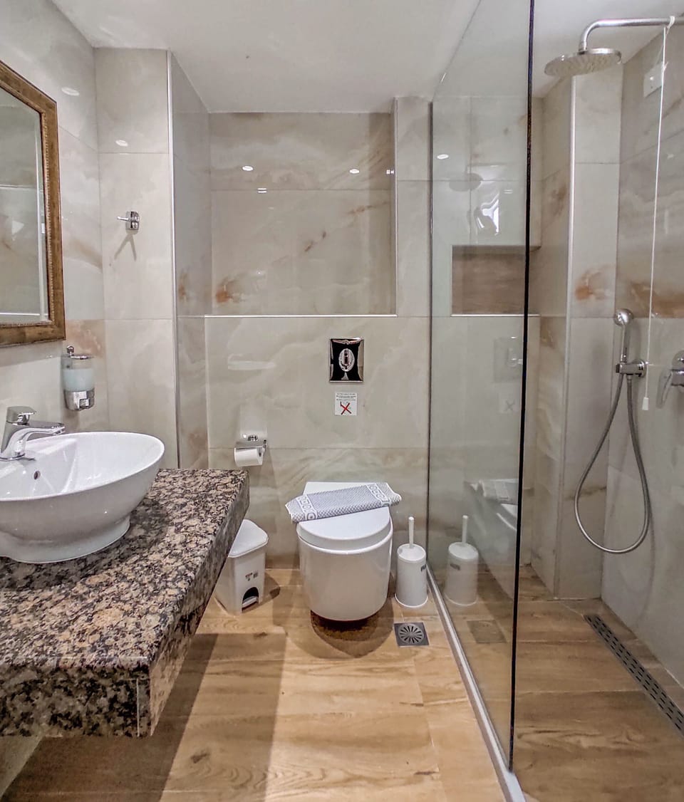 Bathtub, hair dryer, towels, soap