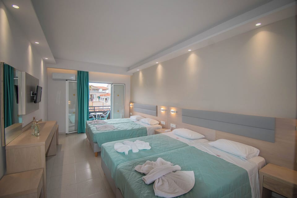 Family Room, Pool View, Poolside | In-room safe, desk, laptop workspace, blackout drapes