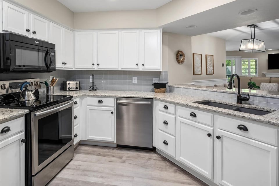 Kitchen, with granite countertops and stainless appliances.