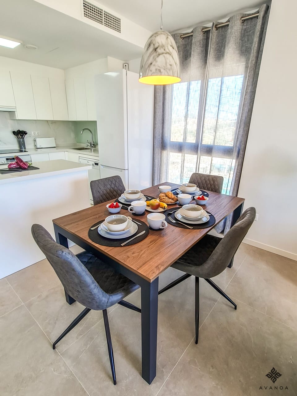 Living-dining room with impressive views of the sea.