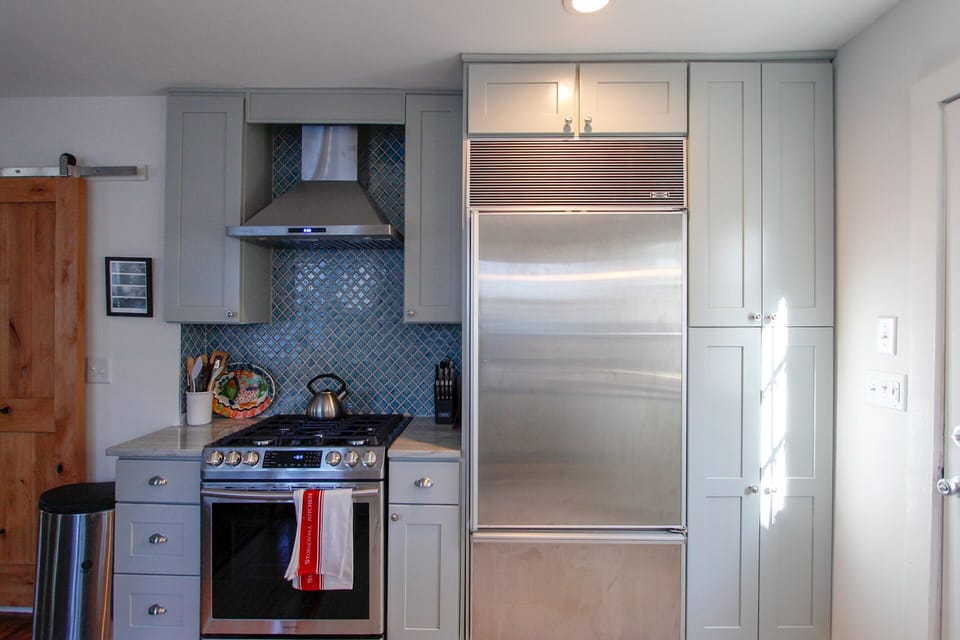 Kitchen with Gas Stove and Over Sized Refrigerator