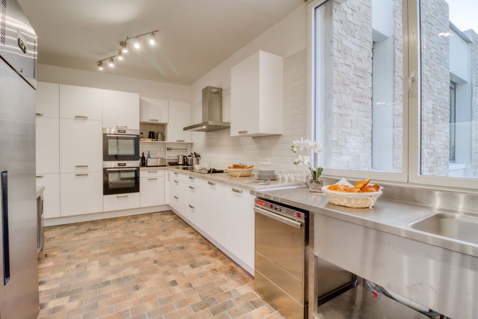Villa Carpe Diem | Private kitchen | Cleaning supplies, dining tables