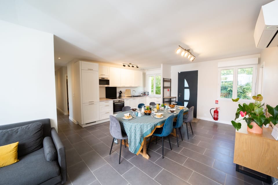 Villa La Roselière | Private kitchen | Cleaning supplies, dining tables