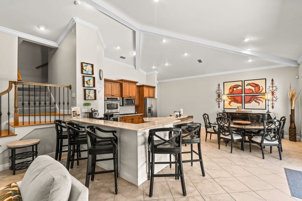 This open-concept kitchen and dining area are bright, spacious, and perfect for your group