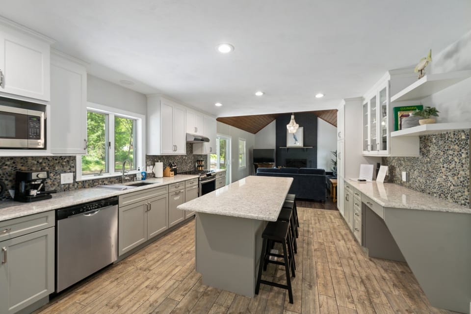 Open concept kitchen looking into family room.