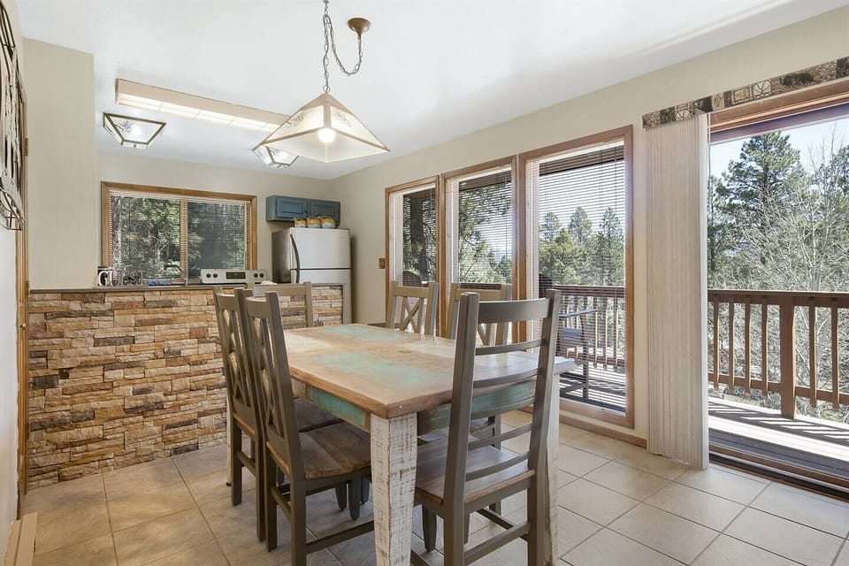 Seating for six at this table with a great view of the green space that surrounds the home. You will often see a family of turkeys and deer in the mornings. 