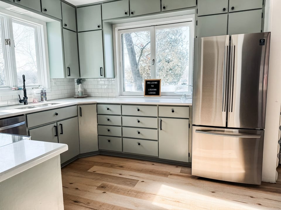 Fully stocked kitchen complete with stainless steel appliances, crock pot, toaster, oven with air fryer, dishwasher and more.