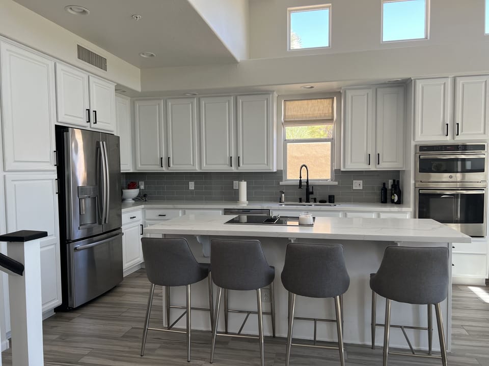 Kitchen w/4 barstools. More barstools are located upstairs in loft. 

