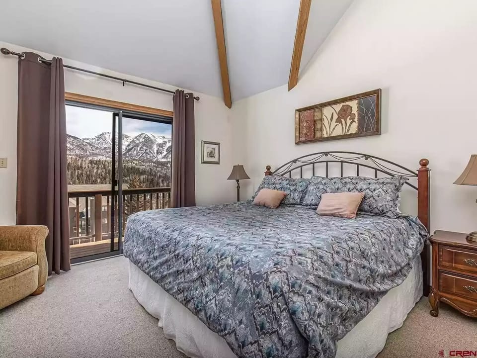 Master bedroom has a private deck with sweeping views of the San Juan Mountains