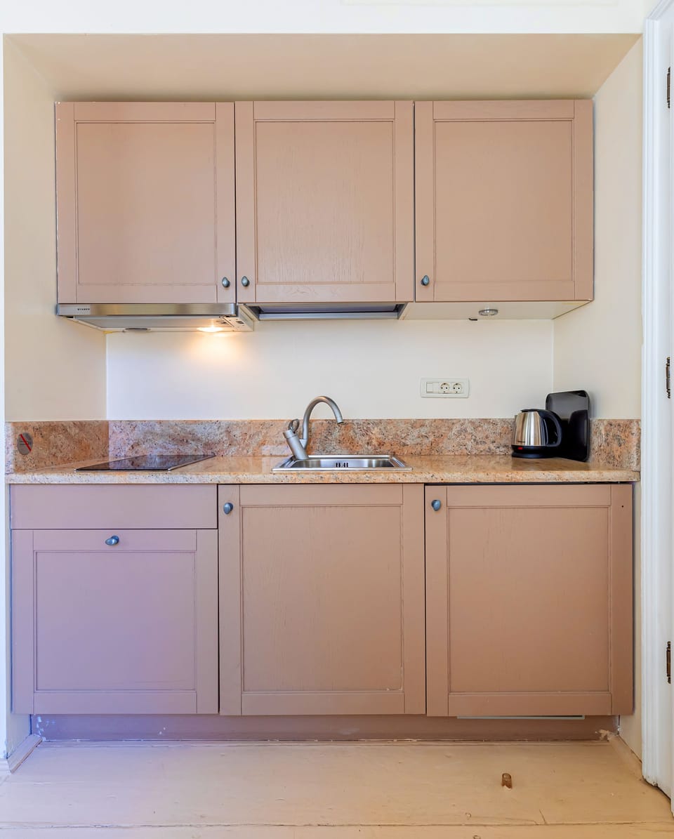 Studio | Private kitchen | Full-size fridge, stovetop, electric kettle, toaster