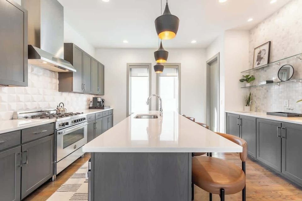 Whip up Nashville magic with sleek countertops and stunning light fixtures!
