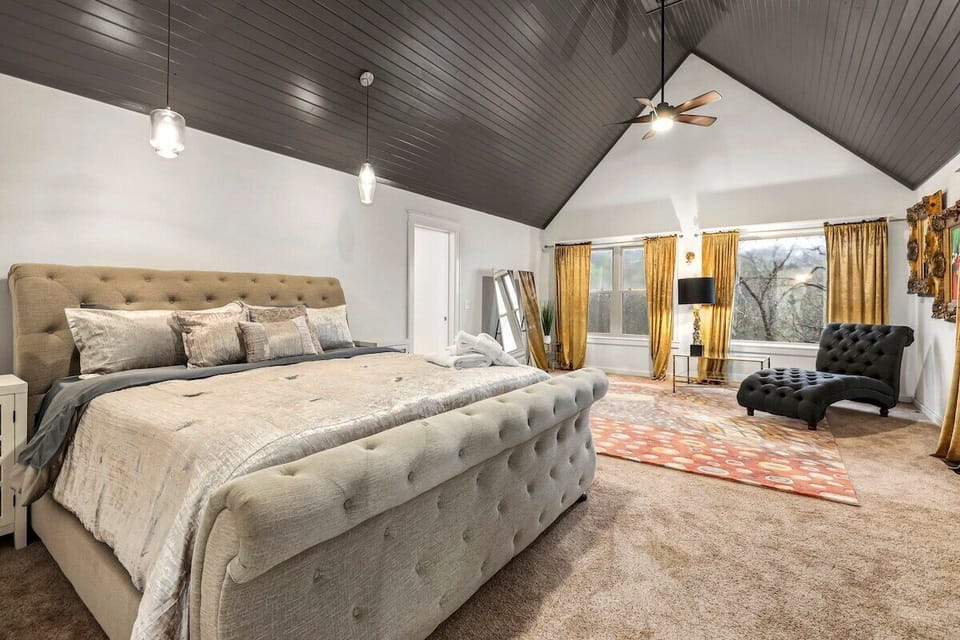 Our second bedroom is complete with a King-size bed, dresser, 55-inch Samsung Smart TV, private seating area and shared bath.