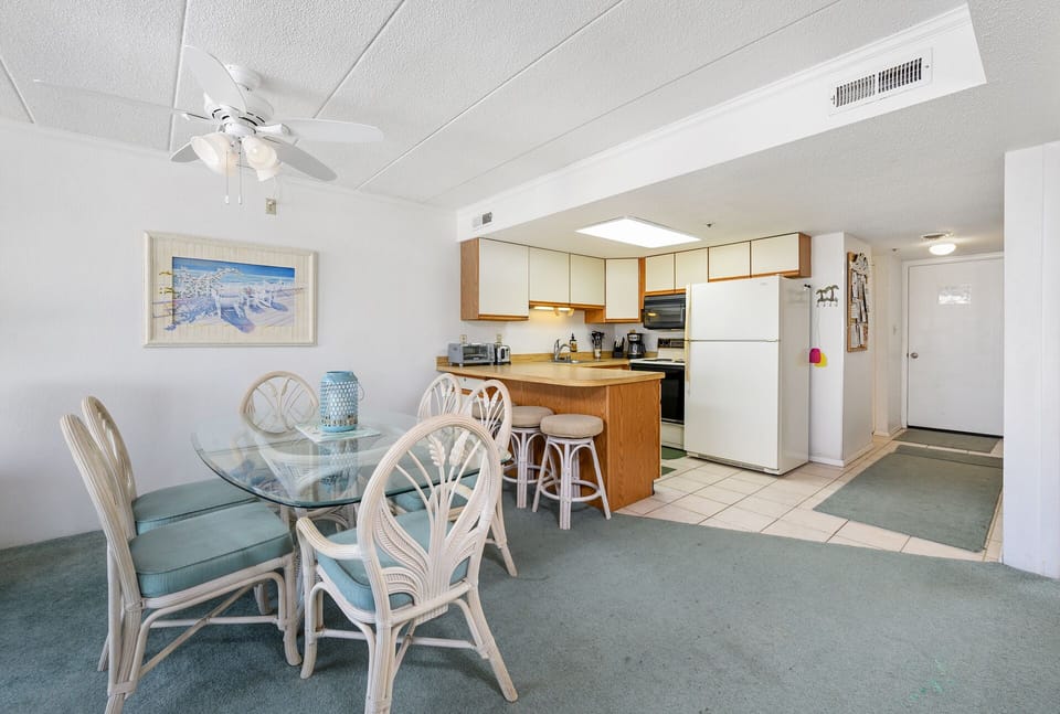 Plenty of seating for the whole family in the dining room/ kitchen area.