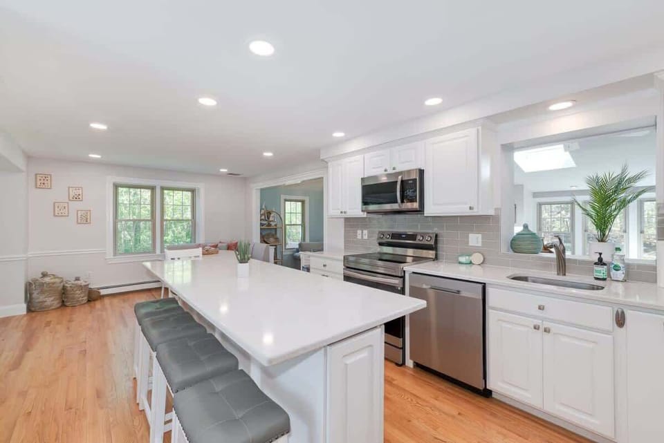 The spacious kitchen offers a huge island with bar seating for cooking delicious meals together.