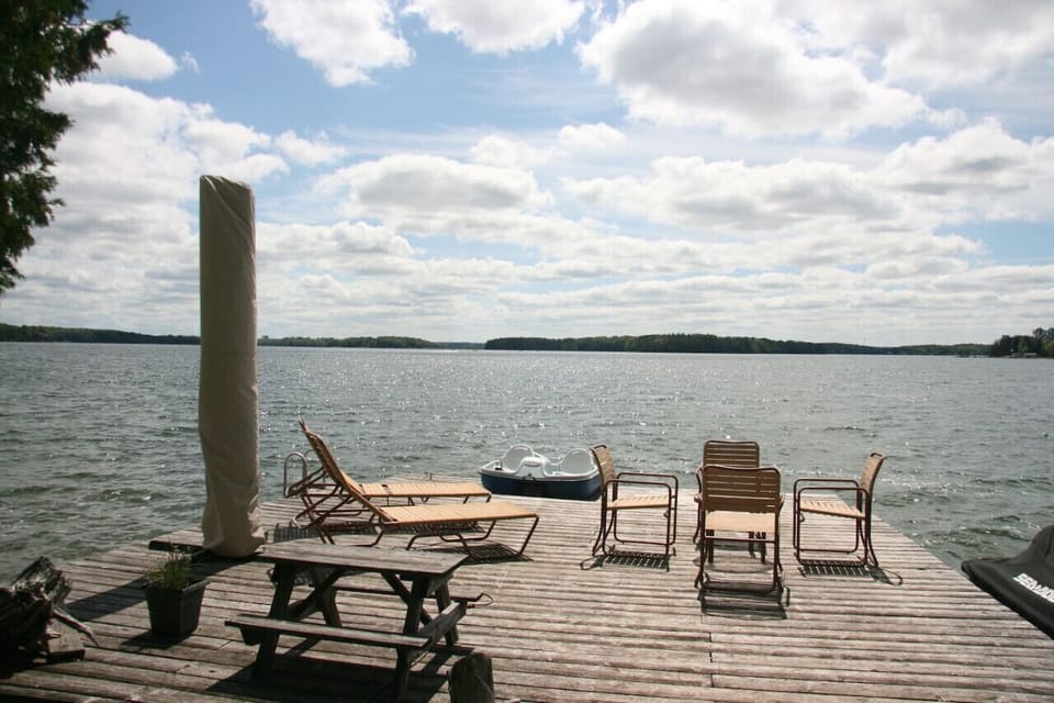 Full sun dock with shade umbrella and loungers.