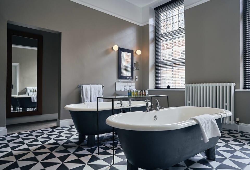 Signature Suite | Bathroom | Free toiletries, hair dryer, towels, soap