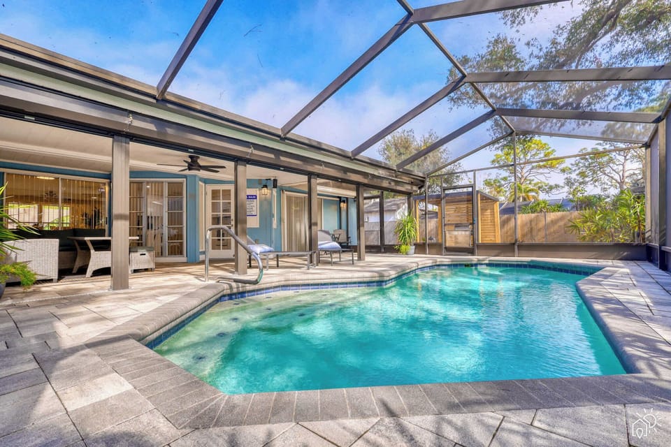 Relax by the glowing heated pool as the sun sets over Sarasota