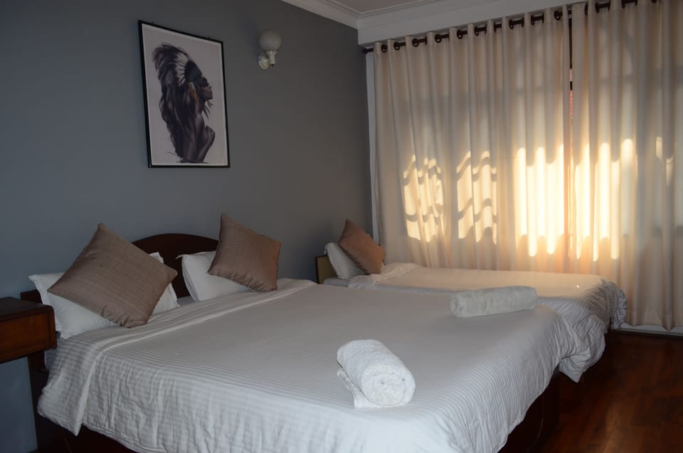 Deluxe Double or Twin Room, Private Bathroom | Individually decorated, individually furnished, desk, rollaway beds