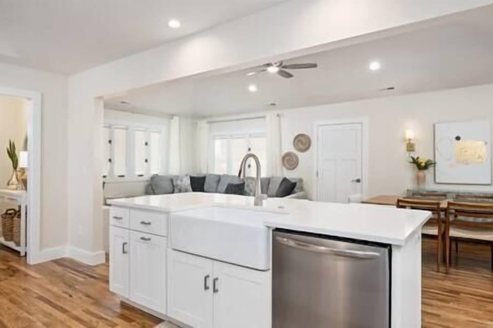 Main living area viewed from kitchen with front entrance to the left