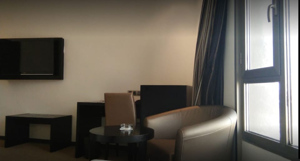 Superior Double Room | Living area | TV