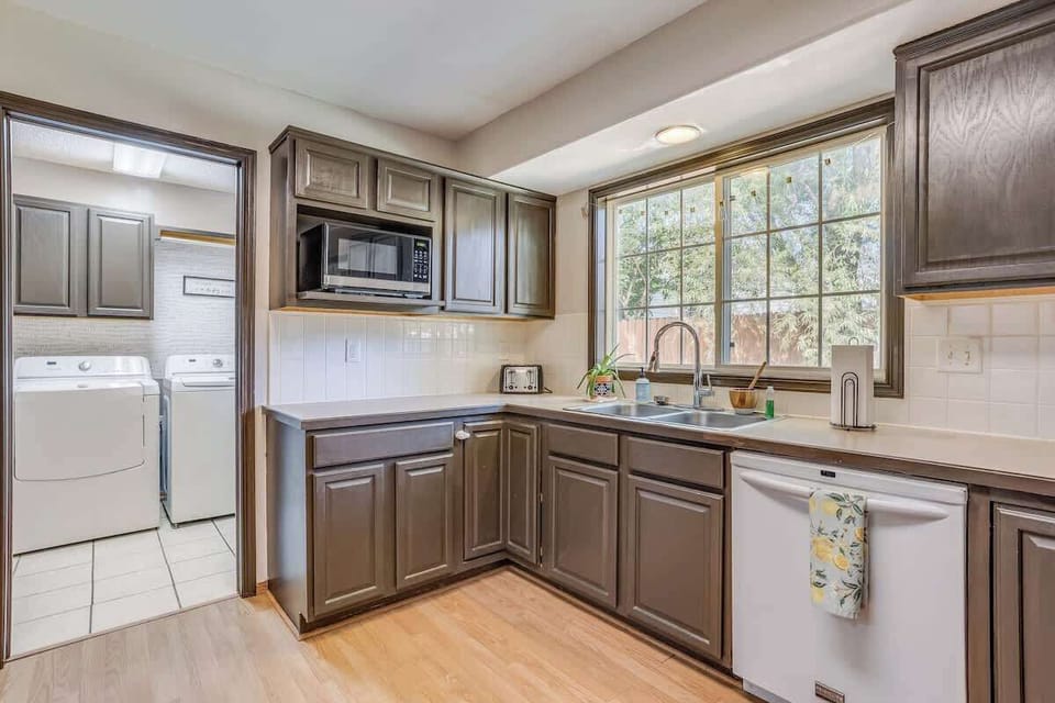 Large kitchen area with all the supplies you need to cook a nice family meal together! We provide a spice rack with the essentials and all kitchen utensils and cookware.