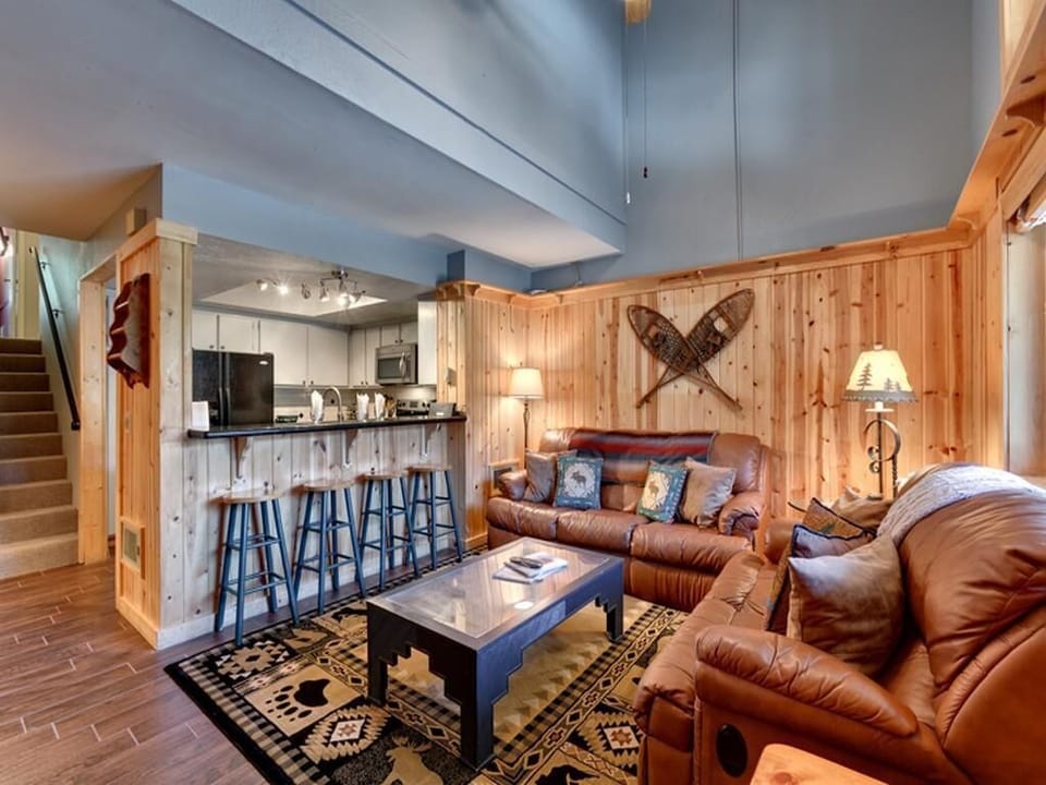 Living Room (Couch seating for 5, stools for 4)