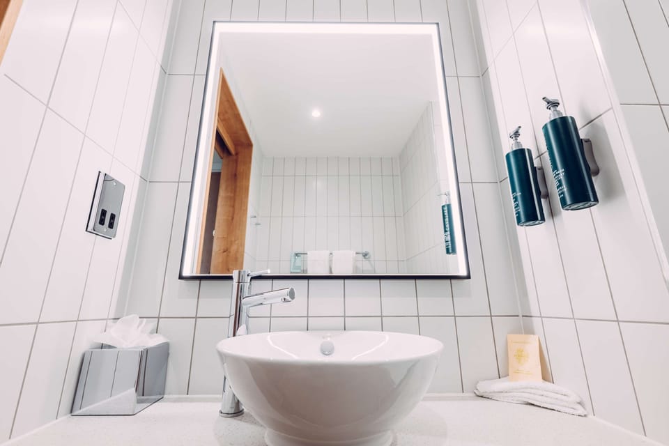 Designer toiletries, hair dryer, bathrobes, towels
