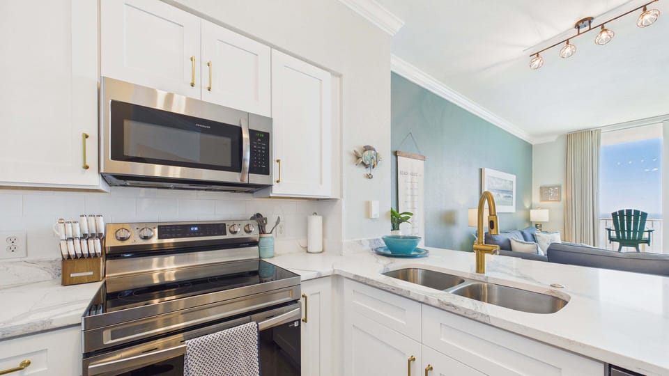 Fully applianced kitchen with all the cooking essentials and newly finished countertops