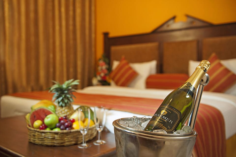 Deluxe Room with Free Upgrade on Availability | Minibar, in-room safe, desk, blackout drapes