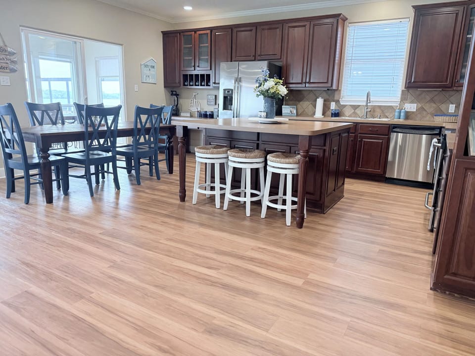 Large open kitchen connected to dining room, living room, and sunroom!