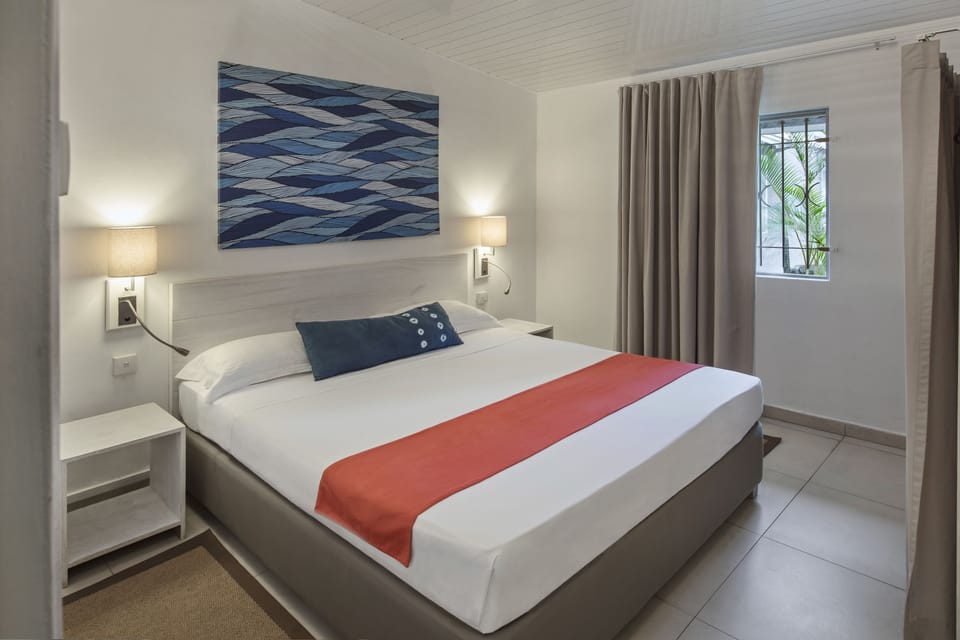 Bungalow Garden View | Minibar, in-room safe, WiFi (surcharge), bed sheets
