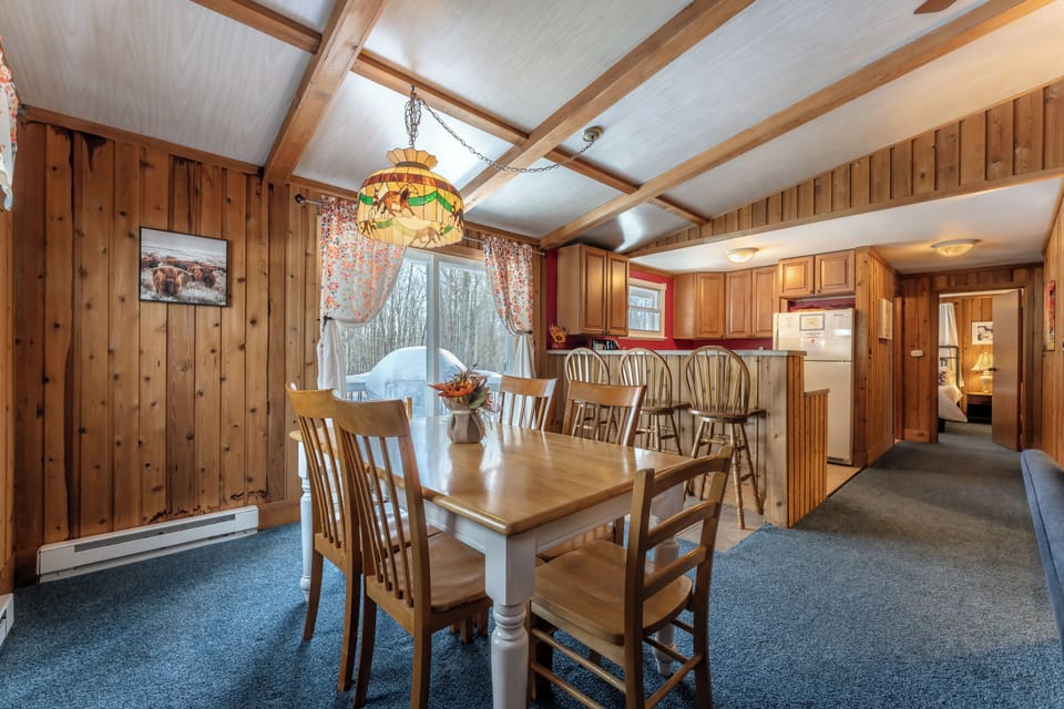 Open living space.  Doors lead to huge wrap around deck, more seating and grill.