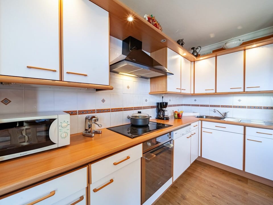 Cabinetry, Countertop, Property, Furniture, Kitchen Sink, Kitchen Appliance, Kitchen Stove, Kitchen, Wood, Sink