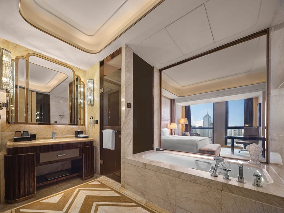 Separate tub and shower, rainfall showerhead, designer toiletries