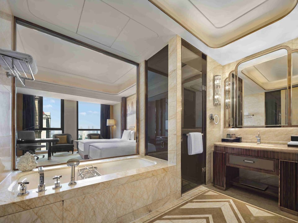 Separate tub and shower, rainfall showerhead, designer toiletries