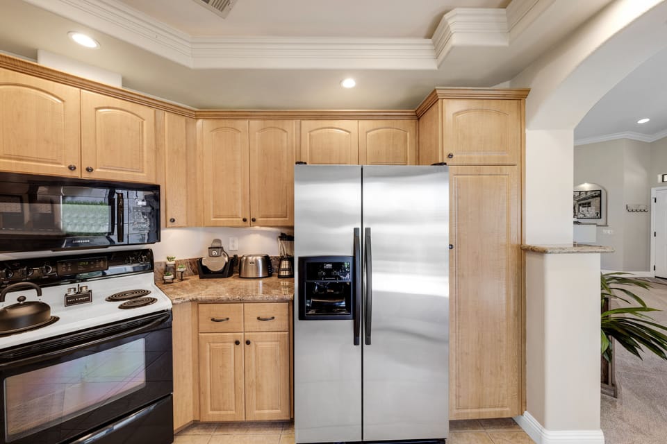 Stove, microwave, refrigerator w/ ice & water, waffle maker, toaster, & blender